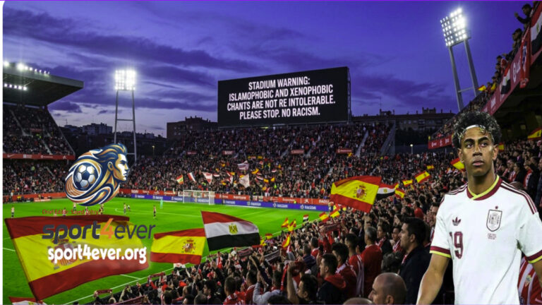 A football player standing on the pitch while the stadium screen shows a warning against Islamophobic and xenophobic chants during the Spain vs Egypt match.