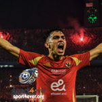 "Achraf Bencharki celebrating a goal for Al Ahly against Zamalek during the Cairo Derby match."