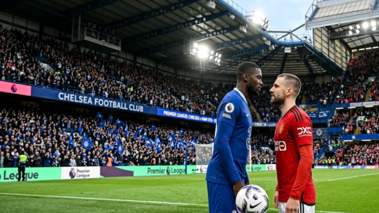 Chelsea and Manchester United players facing each other on the pitch ahead of their Premier League match at Stamford Bridge.